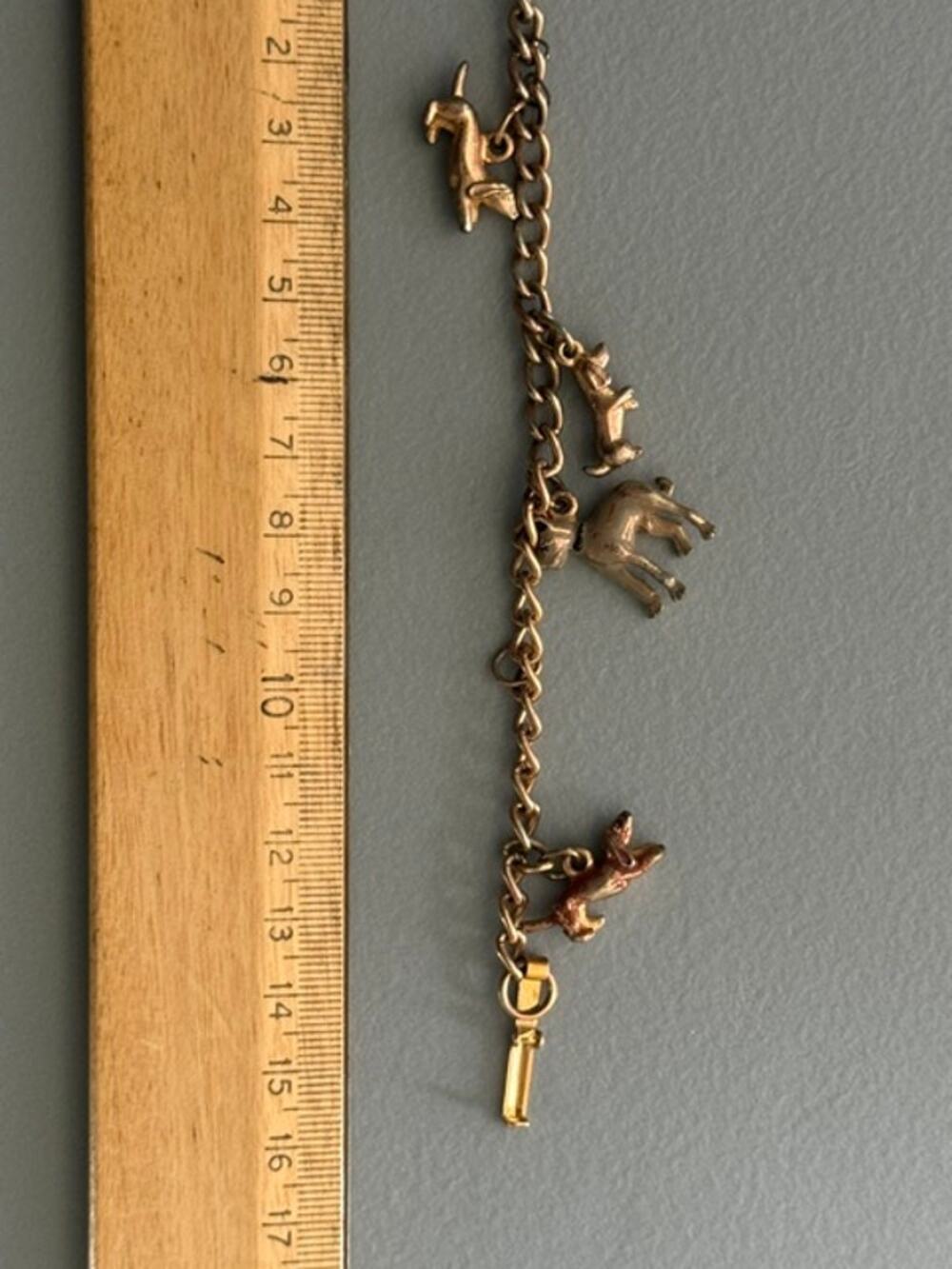 VANTAGE GOLD TONE CHARM BRACELET DOGS